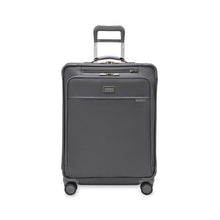 Load image into Gallery viewer, Front view of the suitcase with the telescopic handle partly pulled up.