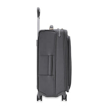 Load image into Gallery viewer, Side view of the suitcase with the telescopic handle partly pulled up.