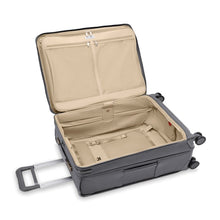 Load image into Gallery viewer, The suitcase laid down with the main compartment lid unzipped and lifted.