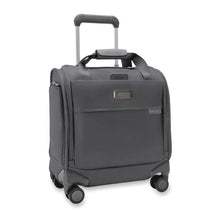 Load image into Gallery viewer, Angled front view of the steel gray baseline cabin spinner. It features a telescopic handle, a set of carrying handles at the top, and 4 spinner wheels. The leather monogram label can be embossed with up to 3 characters.
