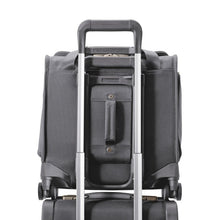 Load image into Gallery viewer, Back panel view of the steel gray cabin spinner suitcase. The attachment feature allows the suitcase to securely ride on top of most Carry-On Trolley Bags.