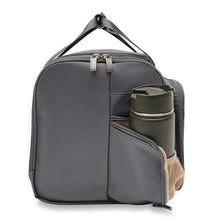 Load image into Gallery viewer, Side view with the panel pocket opened. It features a mesh gusset, ideal for water bottles or a small travel thermos.