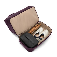 Load image into Gallery viewer, Interior view of the unzipped bottom compartment with a pair of shoes and a cosmetic bag.