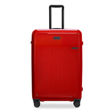 Load image into Gallery viewer, Front panel view of the red suitcase with black accents. The telescopic handle is pulled up.