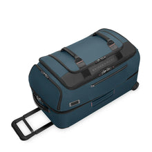 Load image into Gallery viewer, Angled top panel view of the ocean blue wheeled duffle bag .