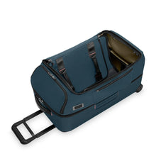 Load image into Gallery viewer, Angled top panel view of the ocean blue wheeled duffle with the main compartment unzipped.