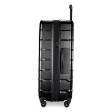 Load image into Gallery viewer, Side panel view of the black hard shell suitcase. It features a grab handle. The expandable feature is unzipped.