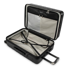 Load image into Gallery viewer, Interior view of the black suitcase. It features a zipper-closing divider with pockets, and adjustable straps.