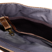 Load image into Gallery viewer, DayTrekr Distressed Leather Slim Crossbody Tablet Messenger - Brown
Image of Interior Main Compartment with trigger key snap, and accessory pocket.
Dimensions: 11.5 x 10 x 1Compartment
