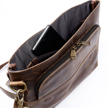 Load image into Gallery viewer, DayTrekr Distressed Leather Slim Crossbody Tablet Messenger - Brown
Front Angled View of main compartment with enough room for a tablet, smart phone, power bank, cables, etc.
Dimensions: 11.5 x 10 x 1