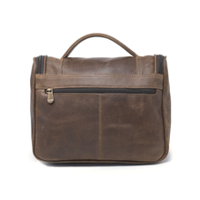 Load image into Gallery viewer, DayTrekr Hanging Toiletry Kit - Brown Distressed Leather
Back Panel View showing back panel zippered pocket. Matching Leather top handle grip.
Dimensions: 11"(w) x 9"(h) x 4"(d)
