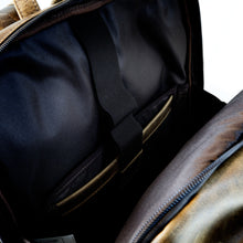 Load image into Gallery viewer, DayTrekr Distressed Leather Bombardier Backpack - Brown
Image of Adjustable Strap to secure laptop and tablet in protected compartment.
Dimensions: 18"h x 13"w x 7"d