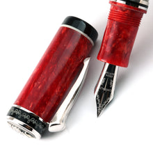 Load image into Gallery viewer, Close up to the fountain pen nib with the cap next to it on a white background.