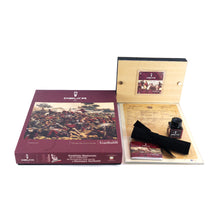 Load image into Gallery viewer, The outer card stock box, packaging, certificates, pen sleeve and ink bottle arranged on a white background.