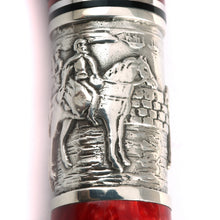 Load image into Gallery viewer, Close up to the silver band with an engraving of a man riding a horse on a town.