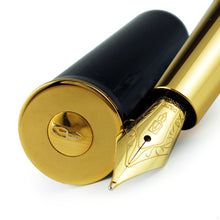 Load image into Gallery viewer, Angled close up of the fountain pen nib and cap.