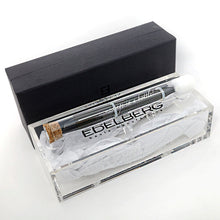 Load image into Gallery viewer, The EB-1007 rollerball pen stored inside the glass test tube case and sealed with a cork. Arranged with the packaging on a white background.