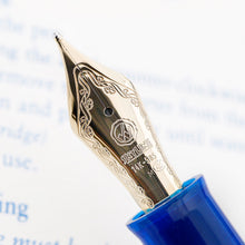 Load image into Gallery viewer, Angled close up to the fountain pen nib with engraved decorations, Eversharp logo, and the text SKYLINE, 14k-585, M