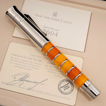 Load image into Gallery viewer, Graf von Faber-Castell pen with a certificate of authenticity on a beige background.