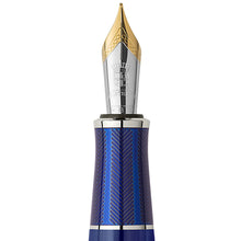 Load image into Gallery viewer, Close up to the pen's nib and grip section. The nib is a magnum bi-colored one made of 18-carat gold.