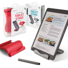 Load image into Gallery viewer, The tablet stands shown inside and outside of their packaging, with a tablet being held by the gray stand.