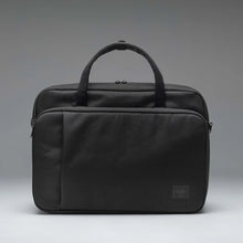 Load image into Gallery viewer, Front panel view of the black Gibson bag on a gray gradient background.