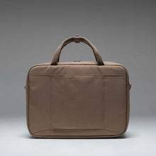 Load image into Gallery viewer, Back panel view of the Light Brown Gibson bag on a gray gradient background.
