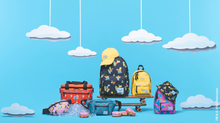 Load image into Gallery viewer, A colorful collection of The Simpsons backpacks and accessories on a blue background with cloud decorations