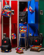 Load image into Gallery viewer, Colorful backpacks and bags in front of open lockers with books underneath.