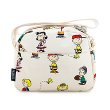 Load image into Gallery viewer, Back view of the Peanuts pattern crossbody bag with the folded shoulder strap resting on the top panel.