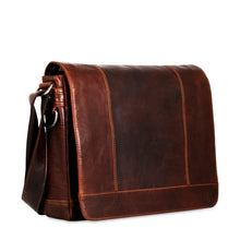 Load image into Gallery viewer, Angled front view of the brown leather messenger bag.