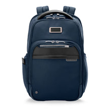 Load image into Gallery viewer, Front panel view of the navy blue backpack. It features three zipper-closing pockets, and a small embossing plate.