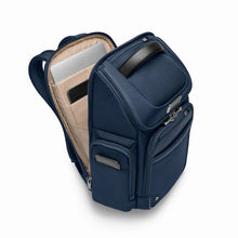 Load image into Gallery viewer, Briggs & Riley @Work Medium Widemouth Backpack in Navy
Image of Front Panel Angled View showing back compartment open with protected compartments for both laptop and tablet.
Dimensions: 17 x 14.5 x 8 in / 43.2 x 36.8 x 20.3 cm