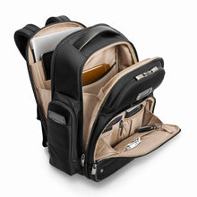 Load image into Gallery viewer, Briggs & Riley @Work Large Cargo Backpack in Black
Image of Front Panel Angled View showing three main compartments with protection and organization for your laptop, tablet, smart phone, cables, pens, cards, tickets, passport, and more.
Dimensions: 18.75 x 16 x 8.75 in / 47.6 x 40.6 x 22.2 cm