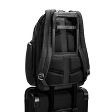 Load image into Gallery viewer, Briggs & Riley @Work Large Cargo Backpack in Black
Image of Back Panel attachment feature which allows this backpack to ride along the telescoping handle of your cabin trolley bag
Dimensions: 18.75 x 16 x 8.75 in / 47.6 x 40.6 x 22.2 cm