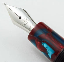 Load image into Gallery viewer, Close up to the pen nib with engraved Krone logo, 18K gold hallmark, and the letter F.