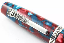 Load image into Gallery viewer, Close up to the silver clip with engraved decorations and the Krone logo.