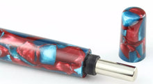 Load image into Gallery viewer, Close up to the bottom of the pen with the top portion to control the piston unscrewed.