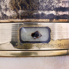 Load image into Gallery viewer, Close up to the band of the cap which encapsulates a fragment of an actual T. Rex tooth.