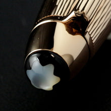 Load image into Gallery viewer, Close up to the top of the cap on a black background.