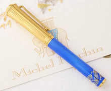 Load image into Gallery viewer, The side of the Fountain Pen laid on top of the Michel Perchin Certificate.