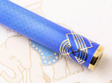 Load image into Gallery viewer, Close Up to the bottom of the pen. The Guilloche design on the barrel can be seen up close along with the Art Deco outline in gold at the bottom.
