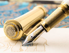 Load image into Gallery viewer, Close up to the fountain pen nib, grip section, and top of the cap with diamond pave.