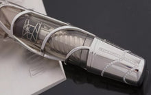 Load image into Gallery viewer, Close up to the pen's bottom section. There is an outline of diamonds on the piston, and a spider on a spiderweb can be seen on the inside.