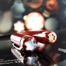 Load image into Gallery viewer, Angled view of the top of the cap and the bottom of the pen.