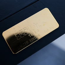 Load image into Gallery viewer, Close up to the engraved golden plate on the presentation box.
