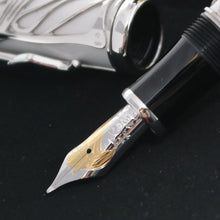 Load image into Gallery viewer, Close up to the fountain pen nib with engraved decorations, Montblanc logo, and text.