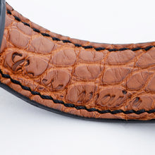 Load image into Gallery viewer, Close up to the embossed french text on the watchband's interior. It translates to handmade.