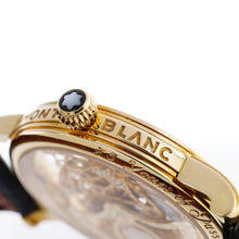 Load image into Gallery viewer, Side close-up of a gold watch with Montblanc engraving on a white background.