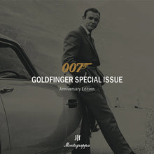 Load image into Gallery viewer, Cover image for the 007 Goldfinger Special Issue Anniversary Edition. The image features the original 007 actor from 1964 leaning on his classic Aston Martin DB5. The Montegrappa logo can be seen at the bottom.